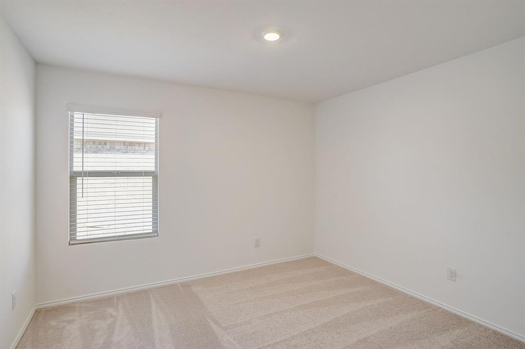 2817 Watchpoint Road Little Elm, TX 75068 - Photo 27 of 40 an empty room with a window
