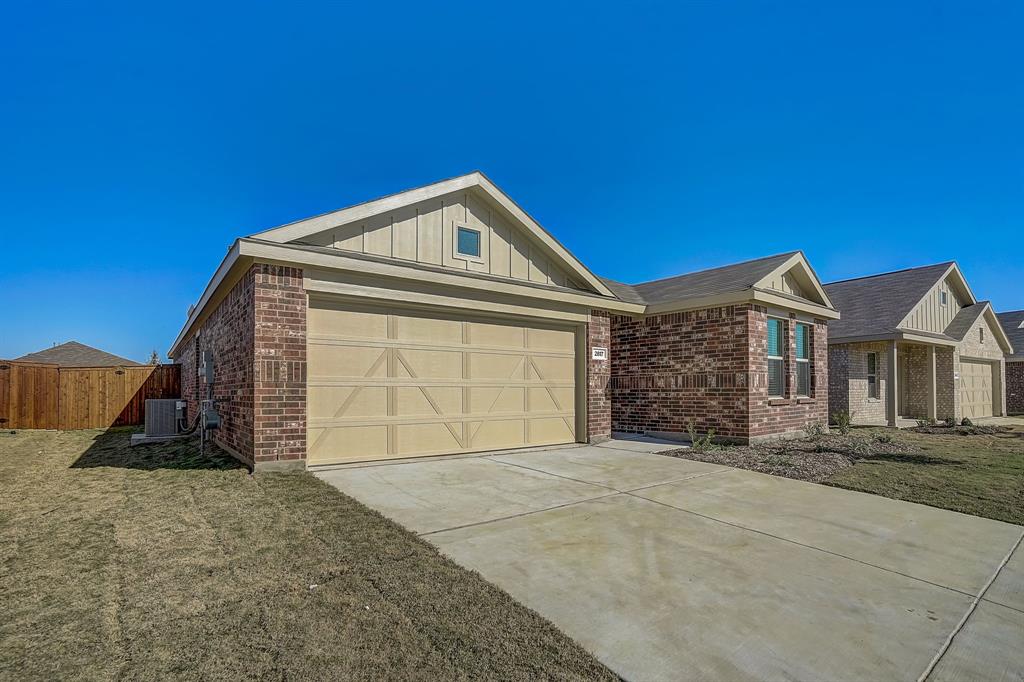 2817 Watchpoint Road Little Elm, TX 75068 - Photo 3 of 40 a front view of a house with a yard