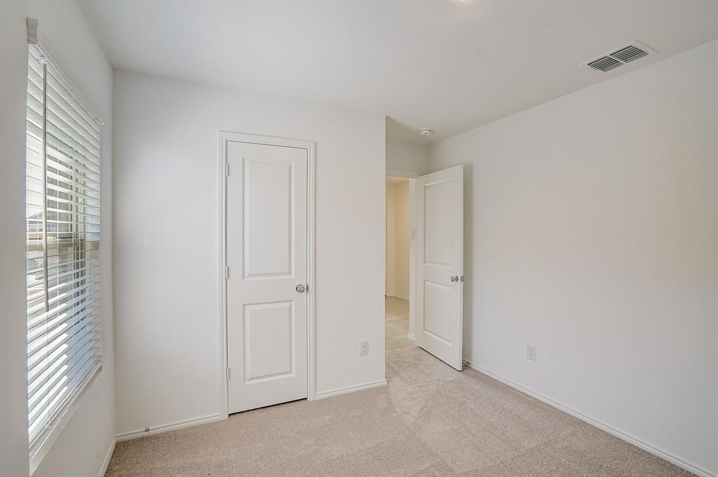 2817 Watchpoint Road Little Elm, TX 75068 - Photo 31 of 40 a view of an empty room with a window