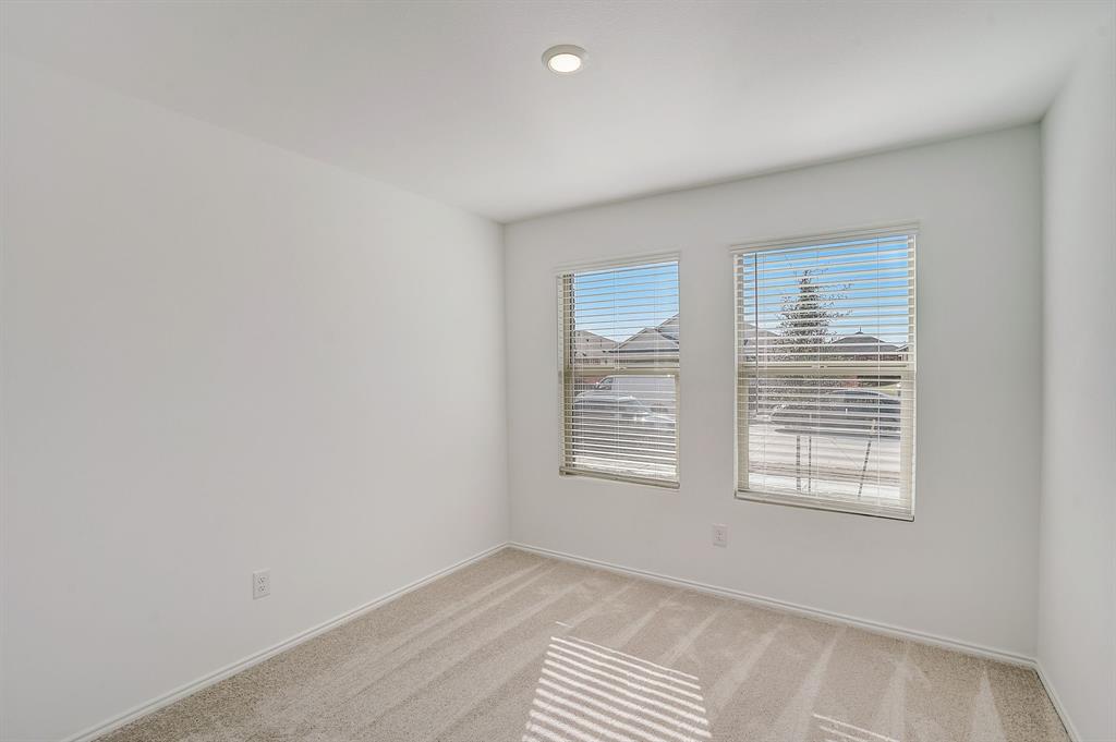 2817 Watchpoint Road Little Elm, TX 75068 - Photo 32 of 40 a view of an empty room with a window