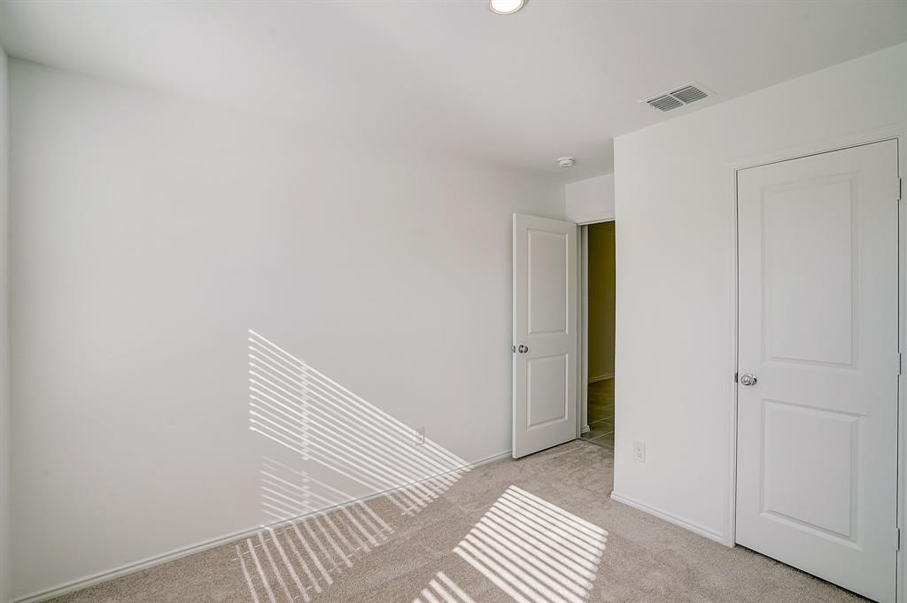 2817 Watchpoint Road Little Elm, TX 75068 - Photo 33 of 40 a view of wooden floor and windows in a room