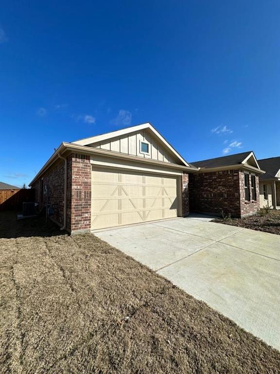 2817 Watchpoint Road Little Elm, TX 75068 - Photo 7 of 40 a front view of a house with a yard