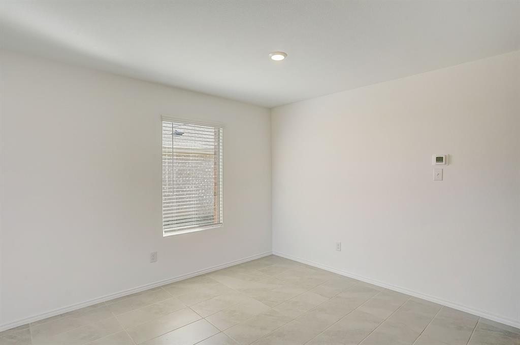 2817 Watchpoint Road Little Elm, TX 75068 - Photo 9 of 40 a view of an empty room with a window