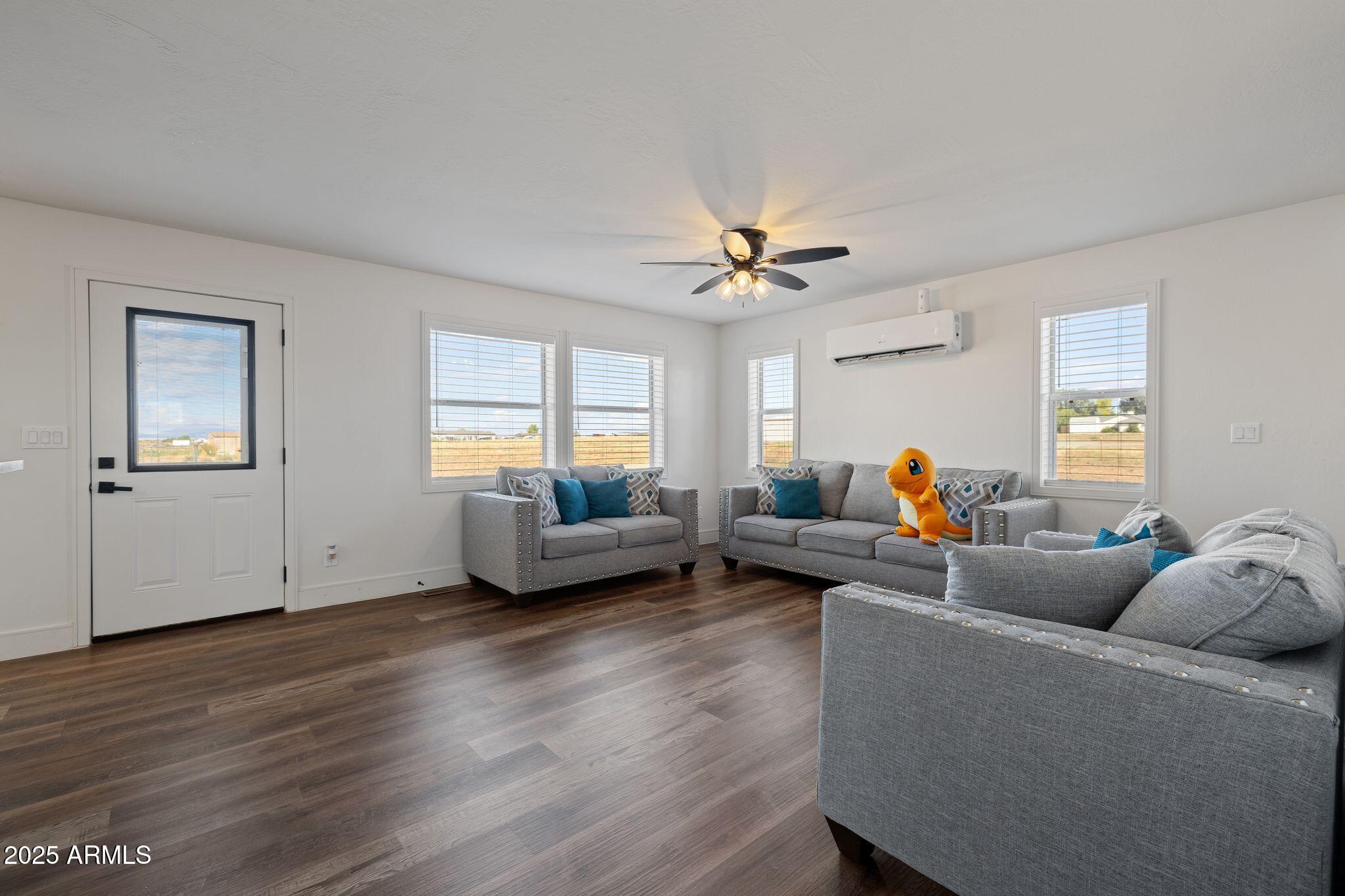 25090 North High Desert Road Paulden, AZ 86334 - Photo 11 of 54 a living room with furniture window and wooden floor