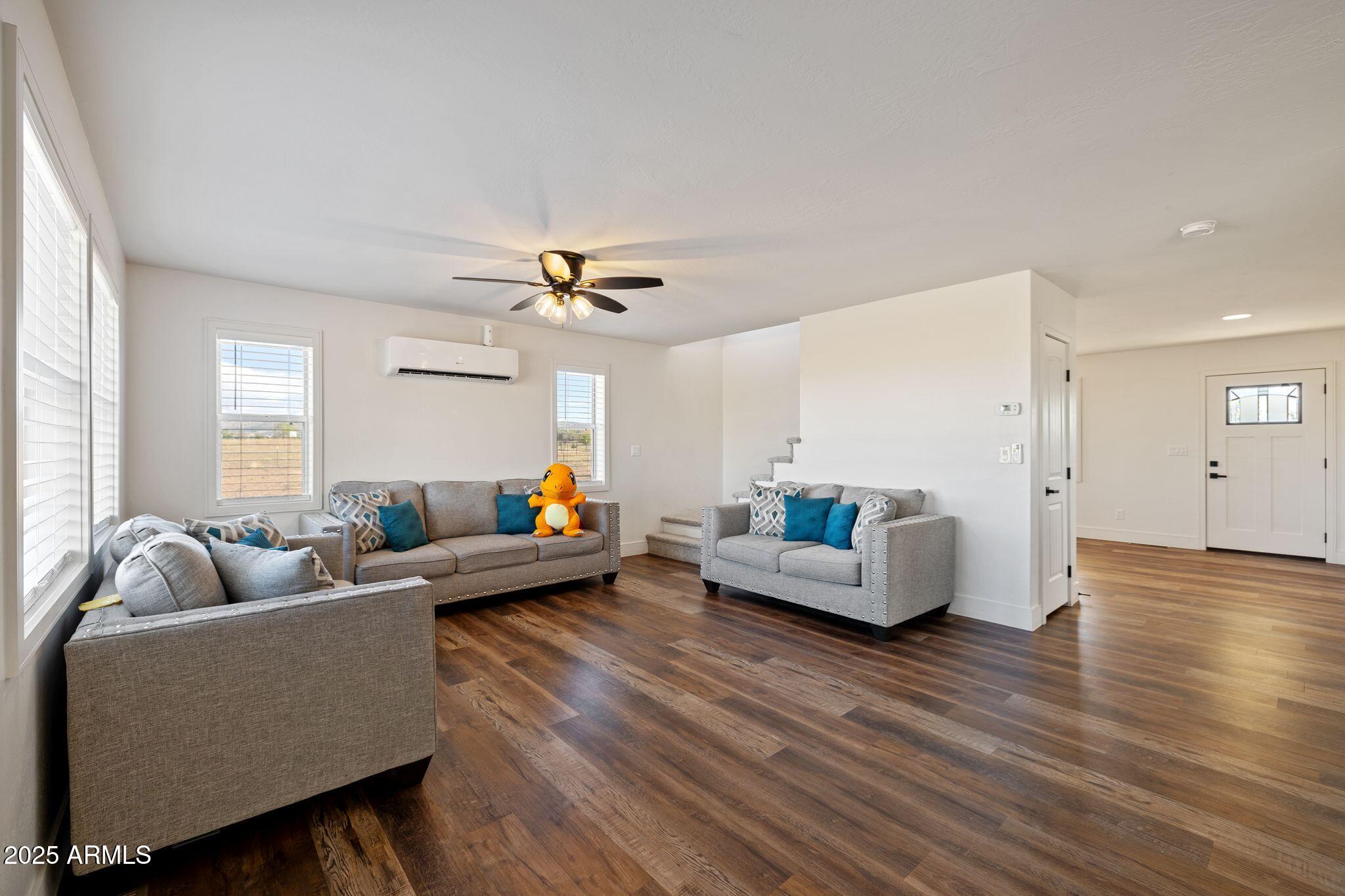 25090 North High Desert Road Paulden, AZ 86334 - Photo 12 of 54 a living room with furniture and a wooden floor