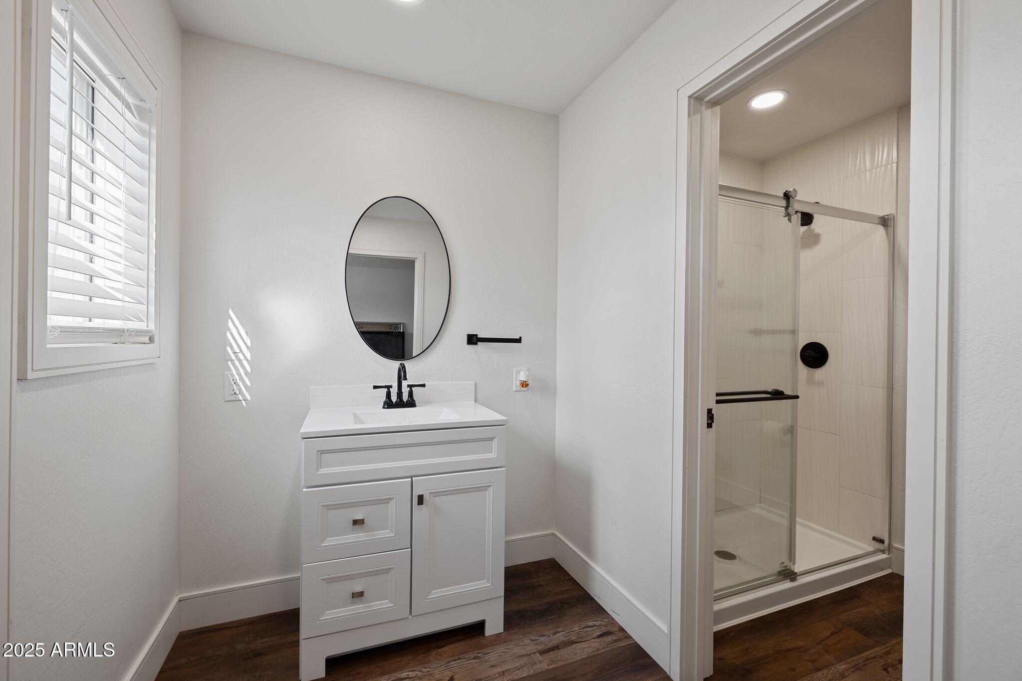 25090 North High Desert Road Paulden, AZ 86334 - Photo 27 of 54 a bathroom with a sink a toilet and window