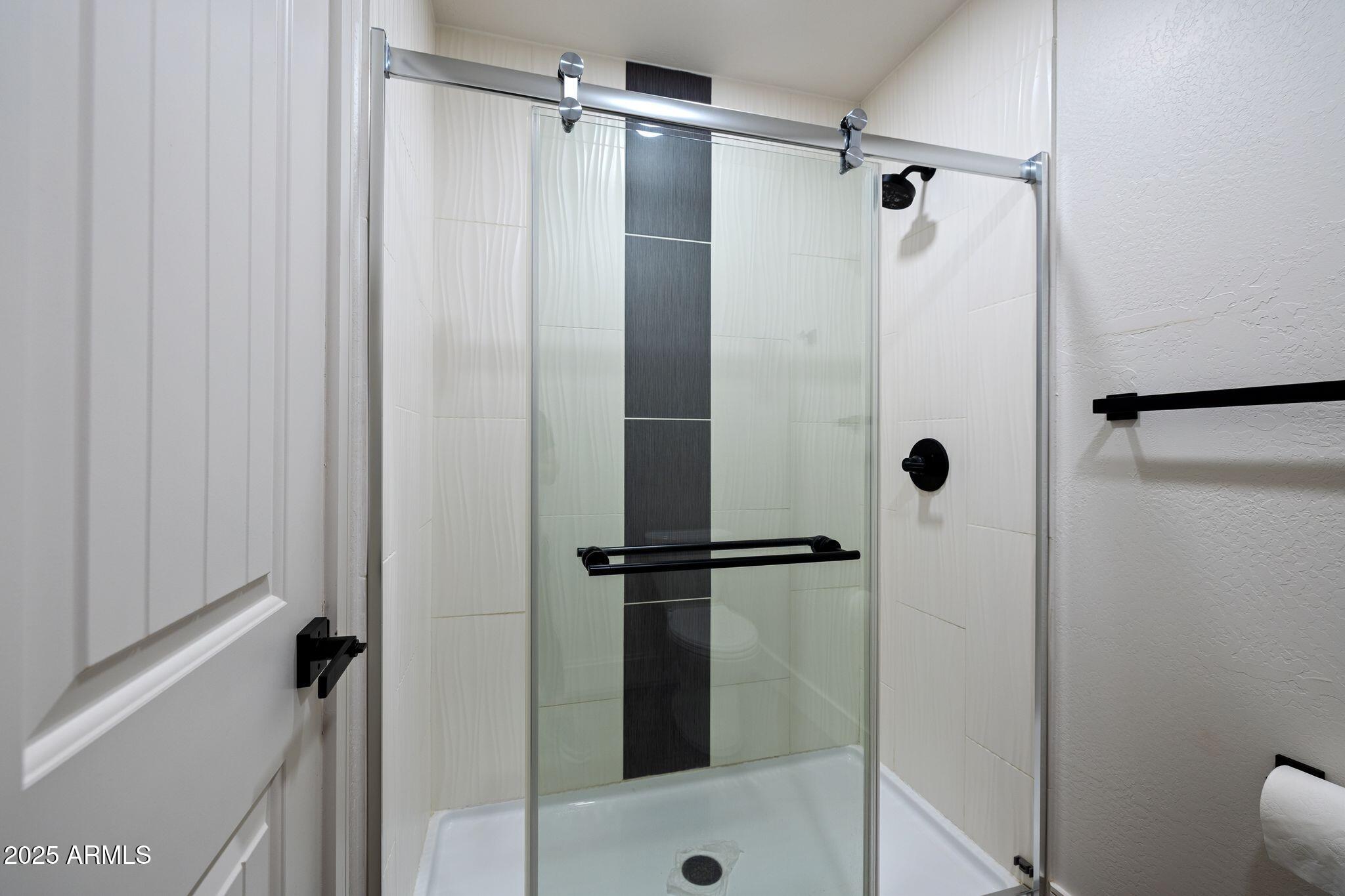 25090 North High Desert Road Paulden, AZ 86334 - Photo 28 of 54 a bathroom with a shower and a toilet