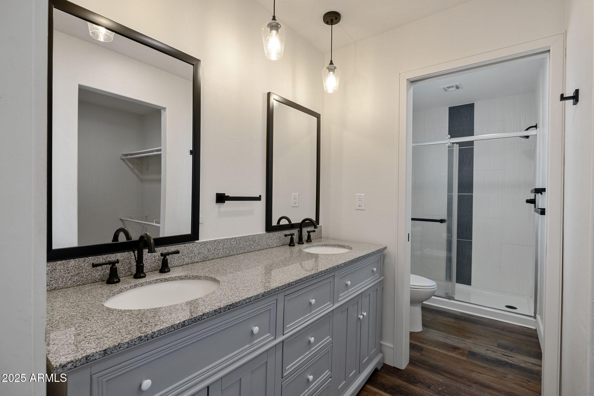 25090 North High Desert Road Paulden, AZ 86334 - Photo 33 of 54 a bathroom with double vanity and a mirror