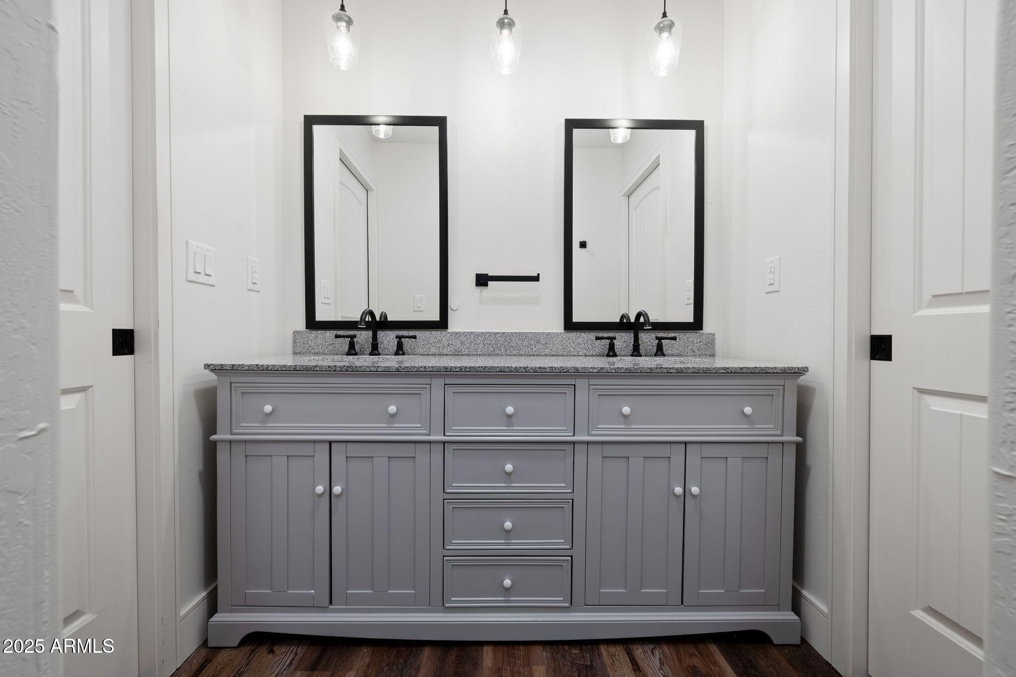 25090 North High Desert Road Paulden, AZ 86334 - Photo 34 of 54 a bathroom with a sink vanity and mirror