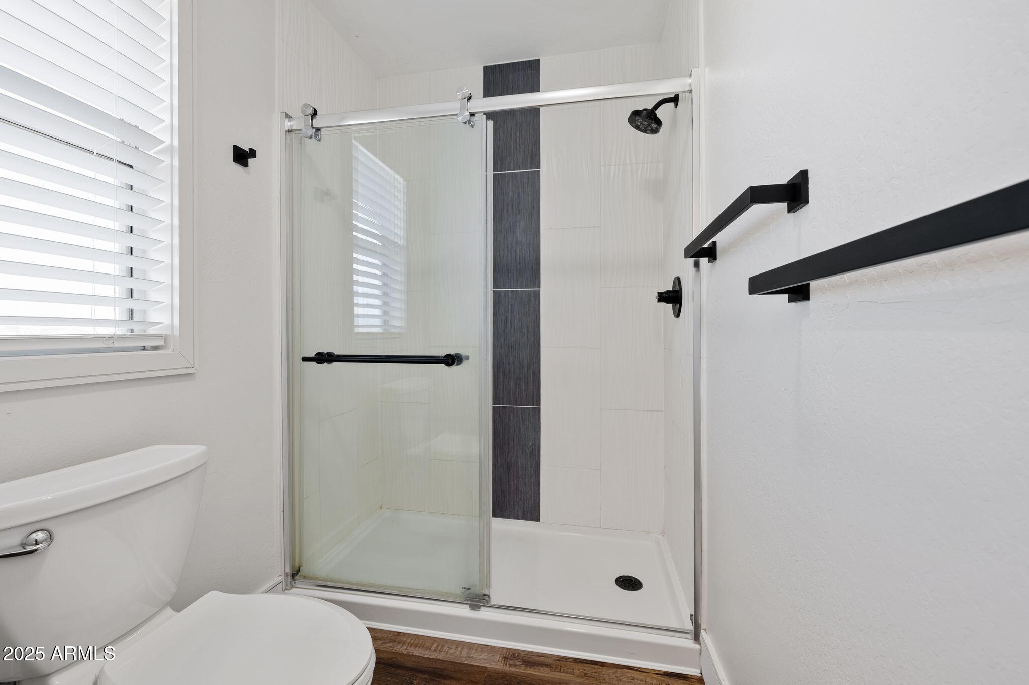 25090 North High Desert Road Paulden, AZ 86334 - Photo 35 of 54 a bathroom with a shower and toilet