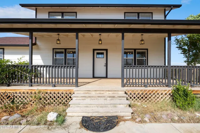 a view of a balcony with wooden floor