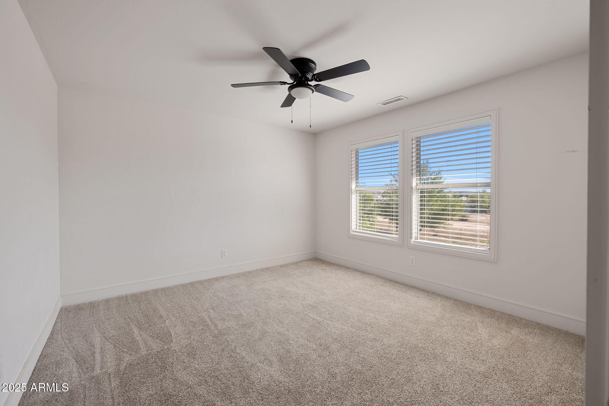 25090 North High Desert Road Paulden, AZ 86334 - Photo 41 of 54 a view of a livingroom with a ceiling fan and window