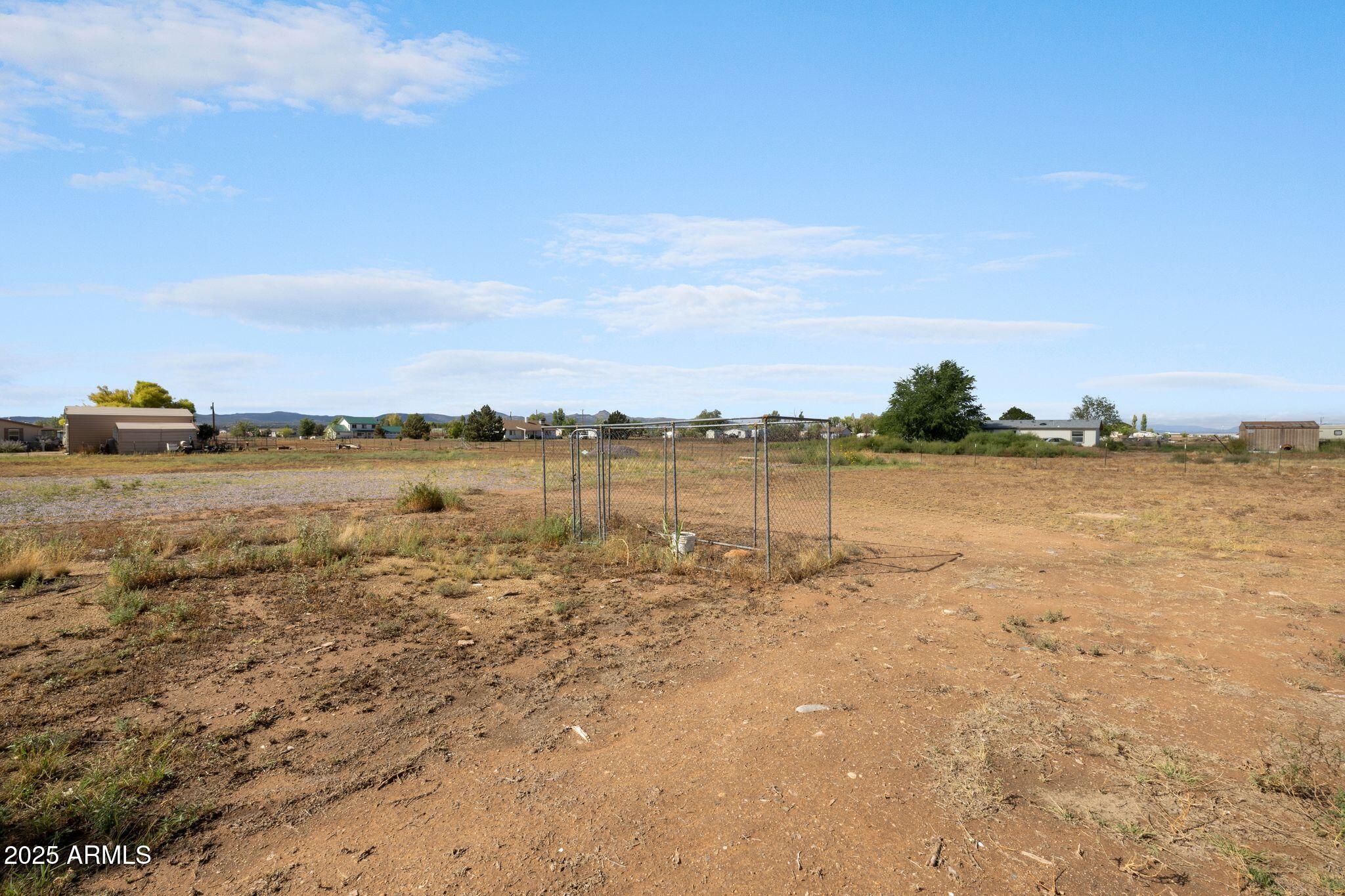 25090 North High Desert Road Paulden, AZ 86334 - Photo 48 of 54 a view of a lake with houses in the back