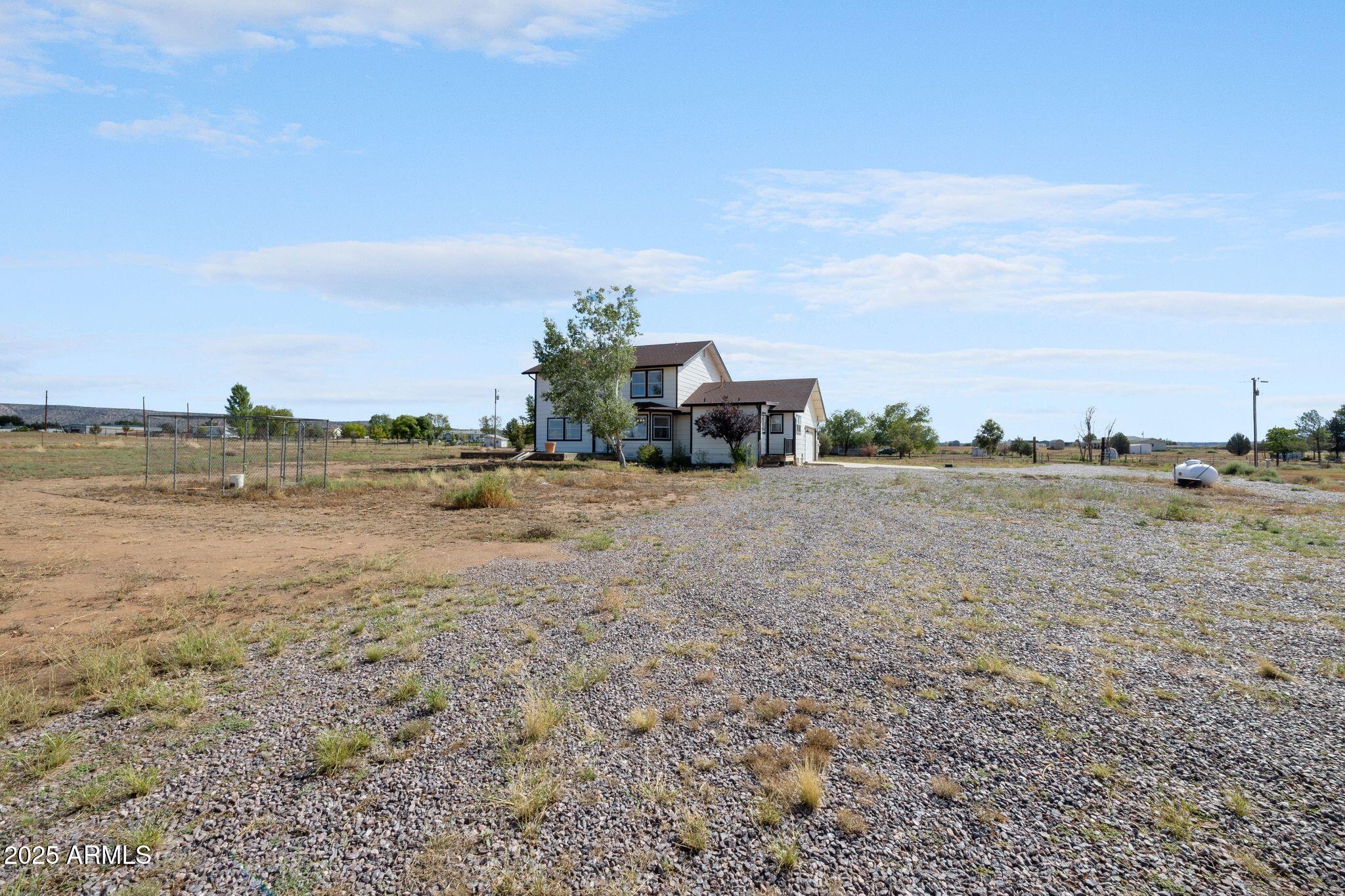 25090 North High Desert Road Paulden, AZ 86334 - Photo 49 of 54 a view of a lake with houses in back