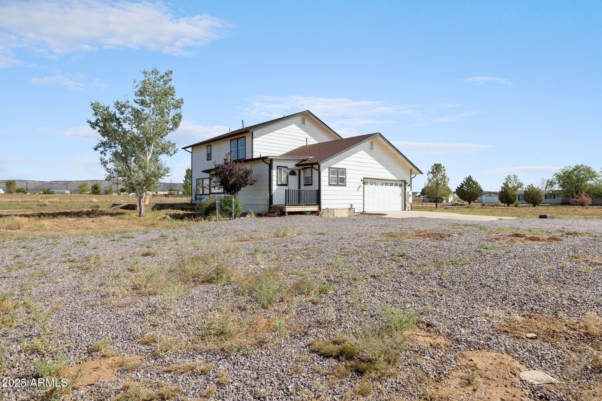 25090 North High Desert Road Paulden, AZ 86334 - Photo 51 of 54 a view of a house with a yard