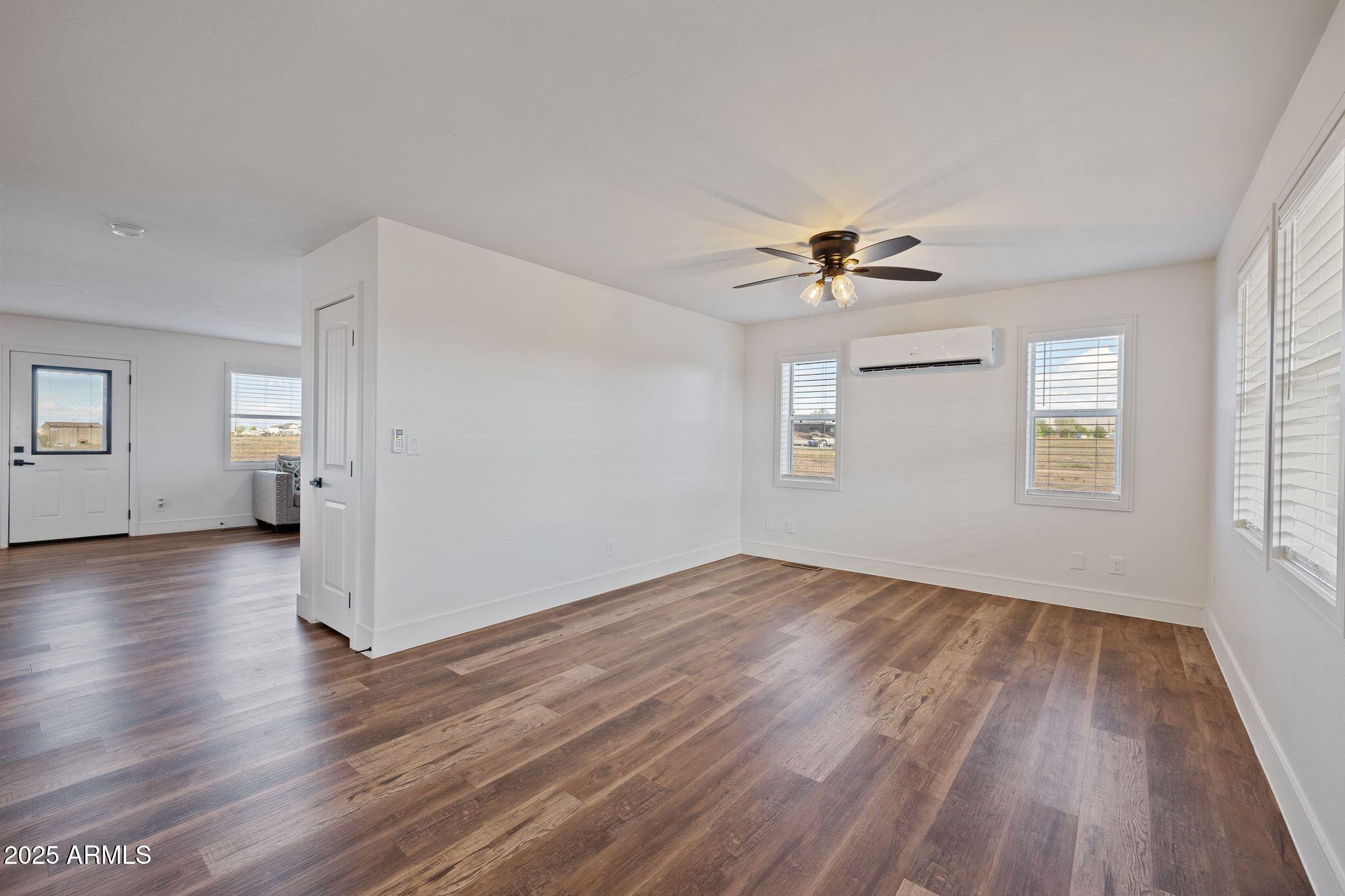 25090 North High Desert Road Paulden, AZ 86334 - Photo 6 of 54 wooden floor in an empty room with a window