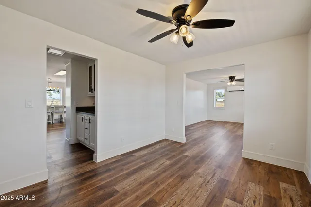 a living room with furniture window and wooden floor