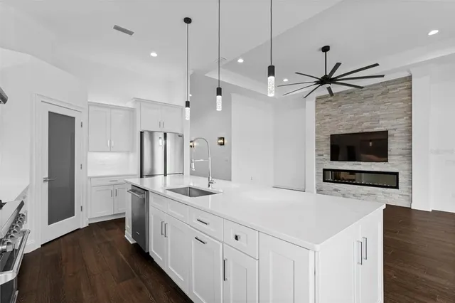 a white toilet sitting next to a bathroom sink