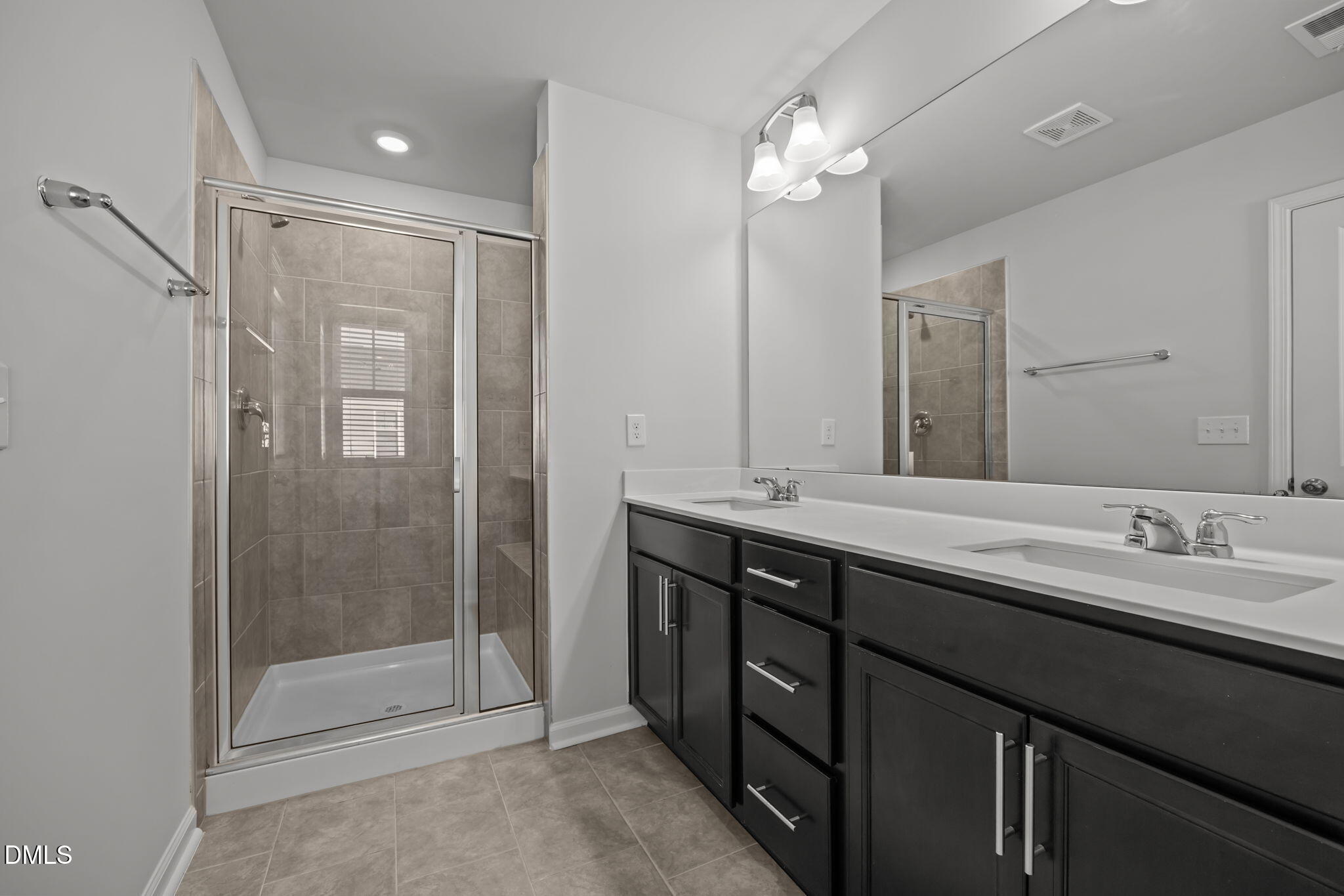 2402 Chert Lane Raleigh, NC 27610 - Photo 22 of 65 a bathroom with a double vanity sink mirror and shower