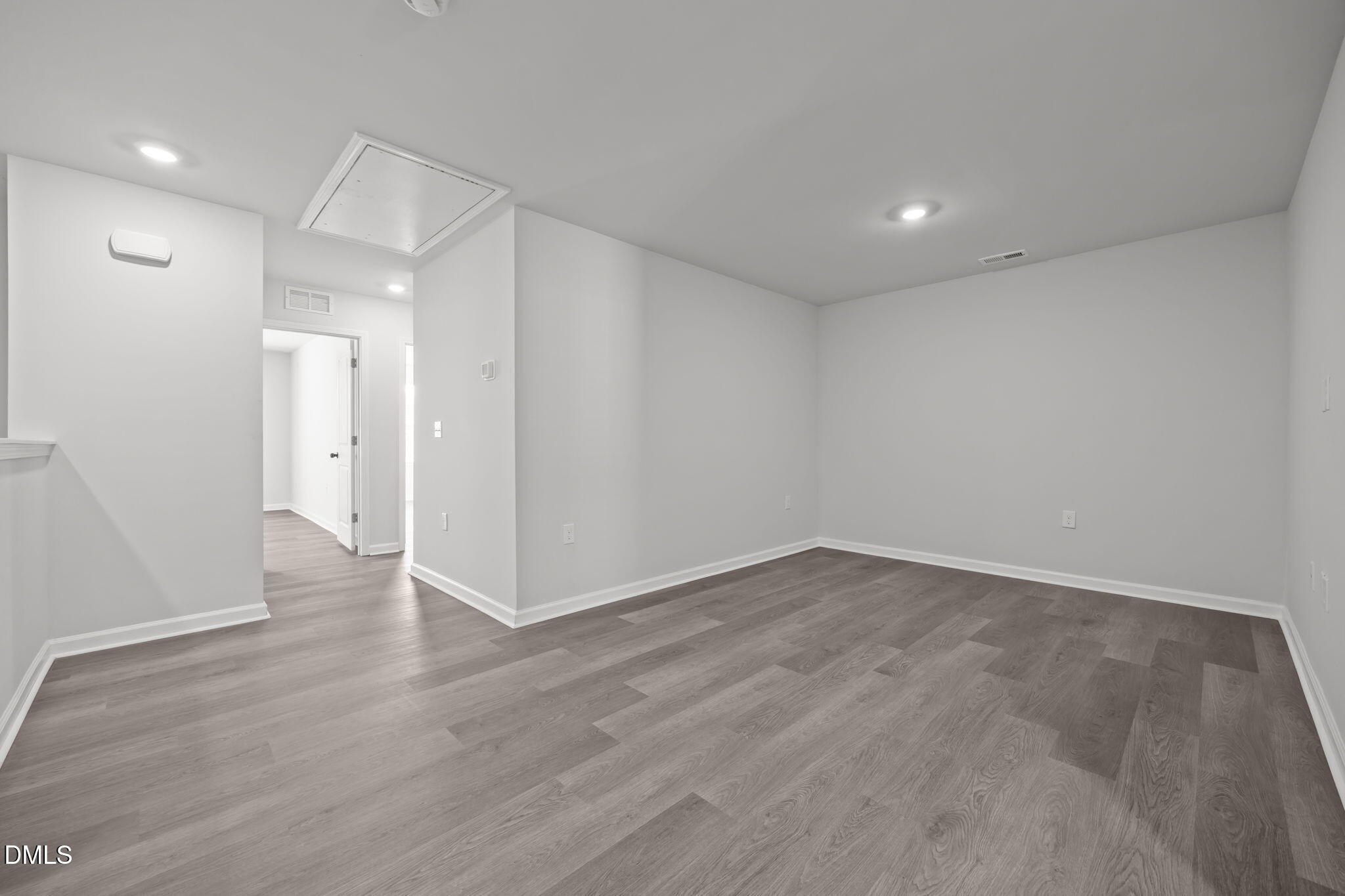 2402 Chert Lane Raleigh, NC 27610 - Photo 29 of 65 wooden floor in an empty room