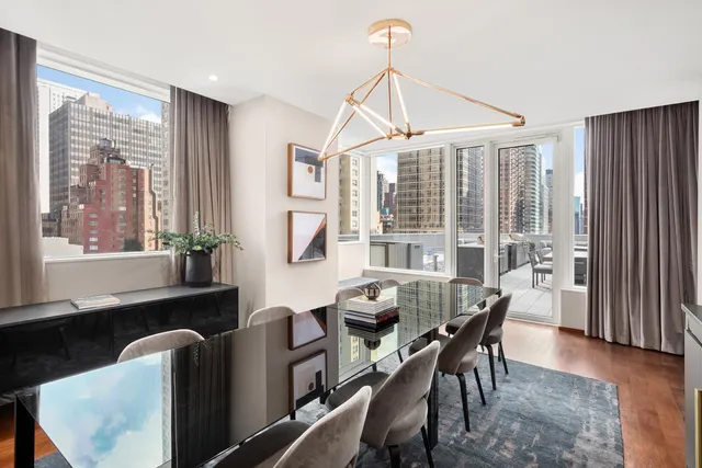 a dining room with furniture window wooden floor