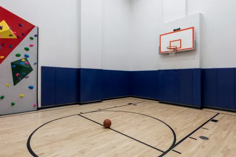 a view of a room with wooden floor and cabinet