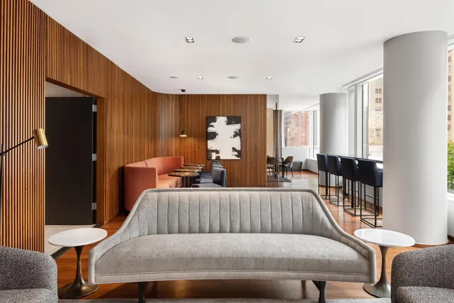 a kitchen with stainless steel appliances a stove a sink and a microwave