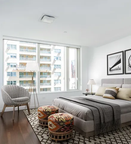 a bedroom with furniture and a window