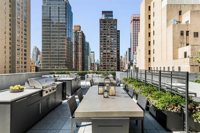 a view of a kitchen with a table and chairs