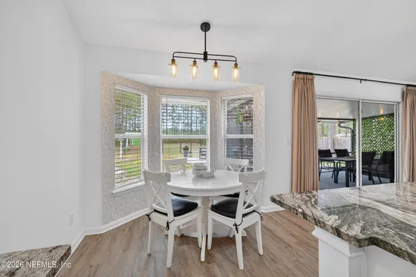 a view of a dining room with furniture window and outside view