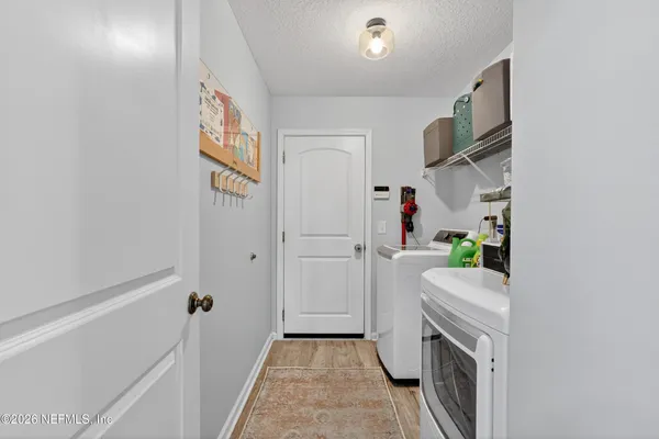 a utility room with a sink a washer and dryer