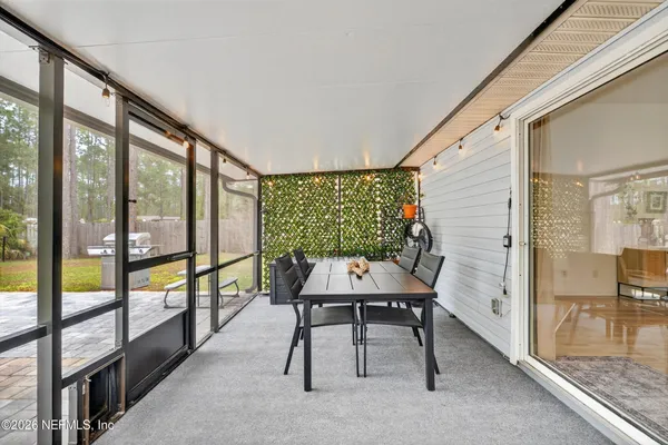 a view of workspace with furniture and window
