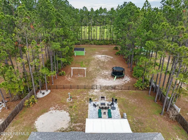 a view of a yard with an outdoor space