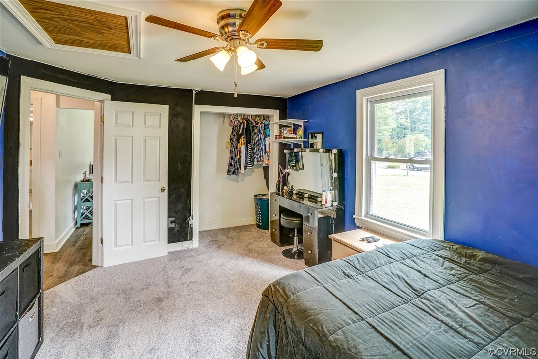 3312 Hawkins Road Henrico, VA 23228 - Photo 12 of 32 a bedroom with a bed and a chandelier