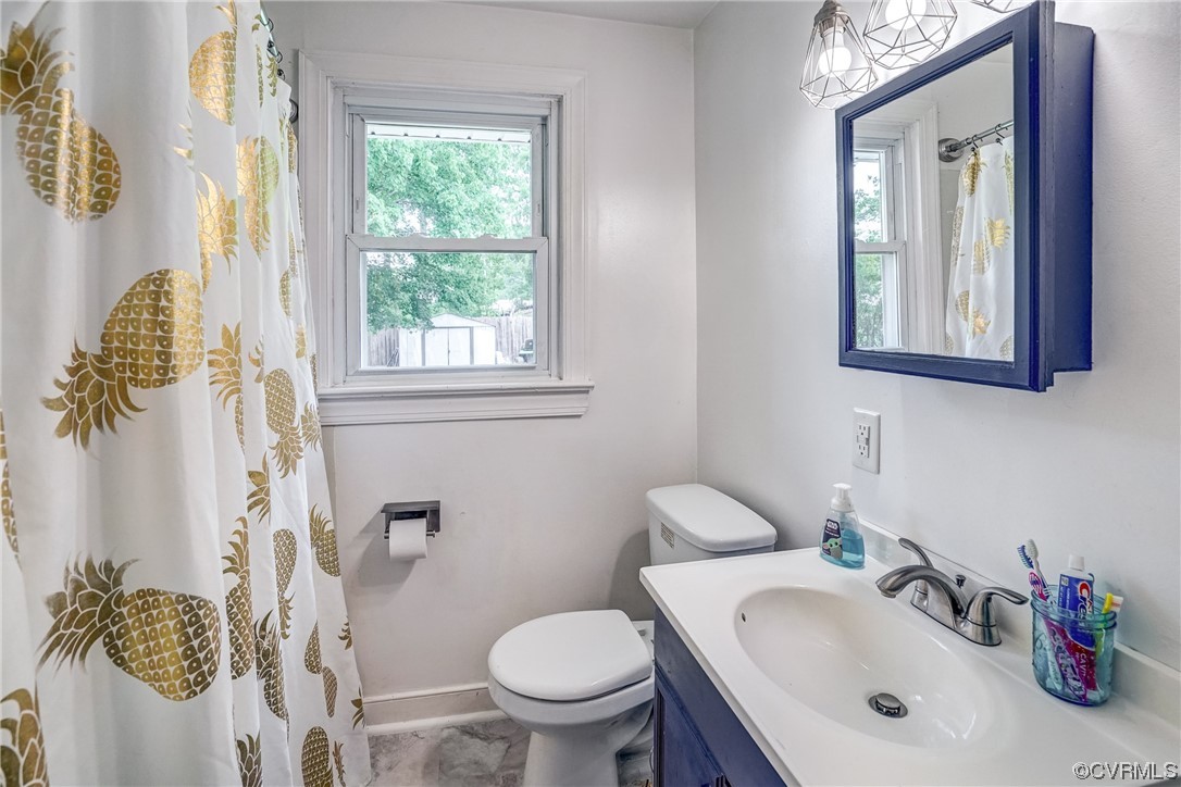 3312 Hawkins Road Henrico, VA 23228 - Photo 15 of 32 a bathroom with a sink toilet and a mirror