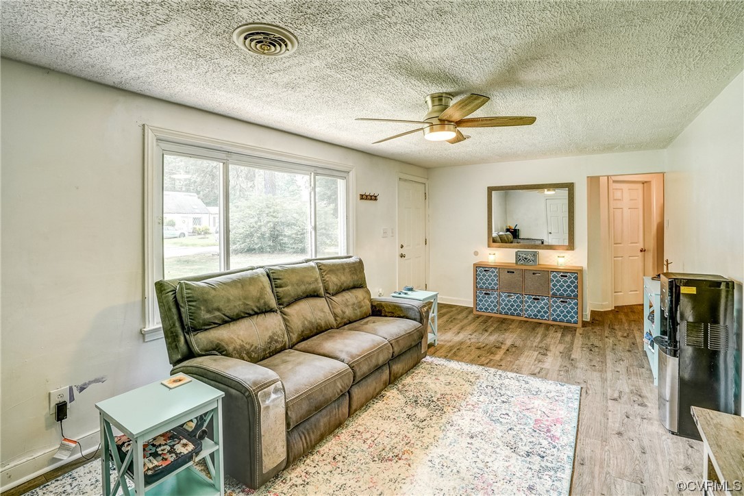 3312 Hawkins Road Henrico, VA 23228 - Photo 24 of 32 a living room with furniture and a large window