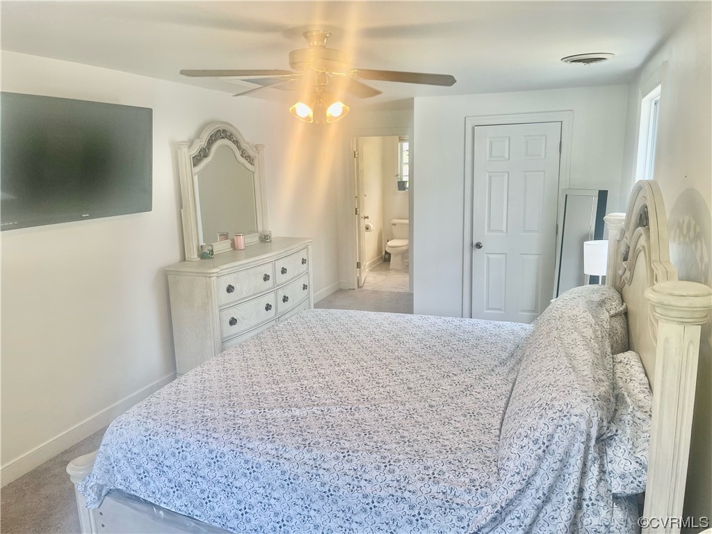 3312 Hawkins Road Henrico, VA 23228 - Photo 30 of 32 a bedroom with a bed and a flat screen tv