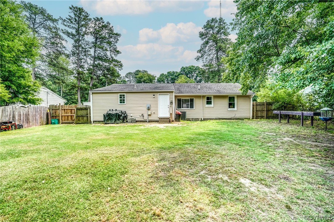 3312 Hawkins Road Henrico, VA 23228 - Photo 8 of 32 a front view of a house with a yard and trees