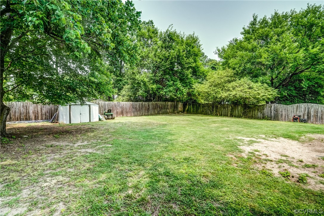 3312 Hawkins Road Henrico, VA 23228 - Photo 9 of 32 a backyard of a house with lots of green space