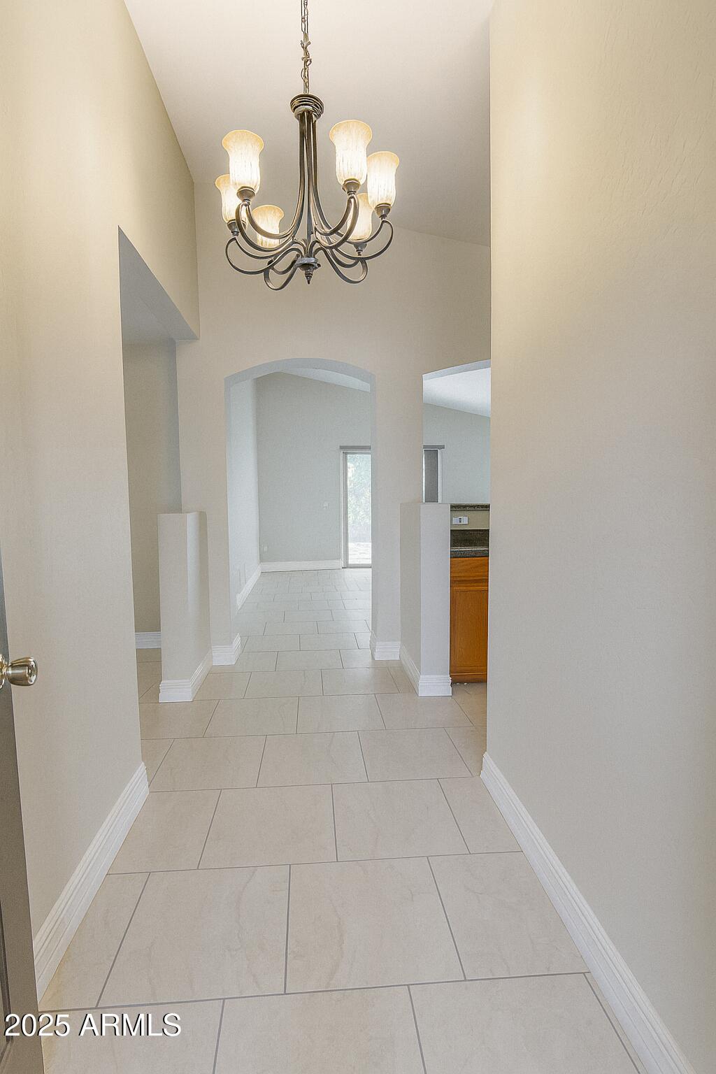 23993 West Pecan Road Buckeye, AZ 85326 - Photo 2 of 12 a view of a chandelier in big room and chandelier