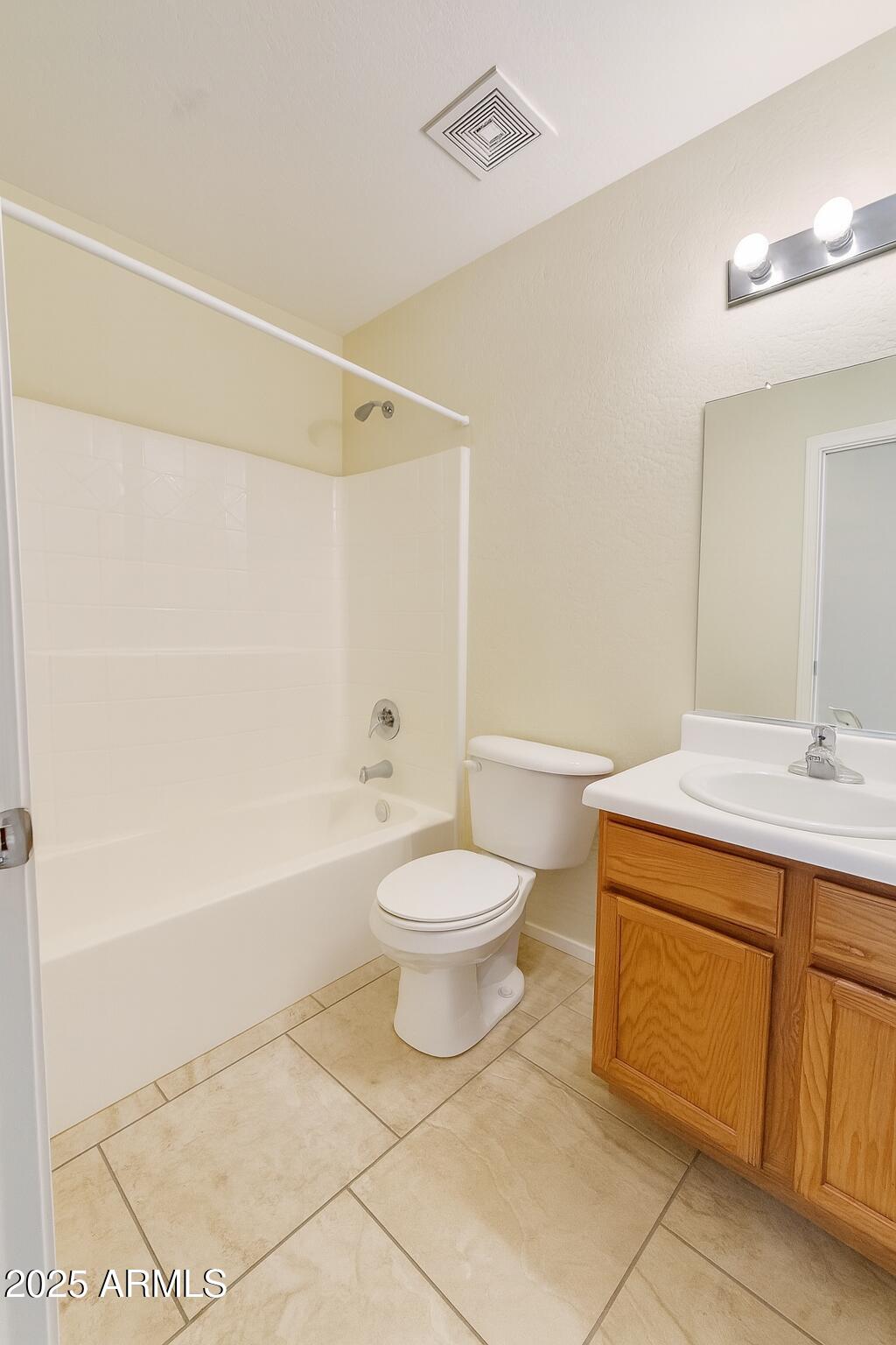 23993 West Pecan Road Buckeye, AZ 85326 - Photo 7 of 12 a bathroom with a sink a toilet and shower
