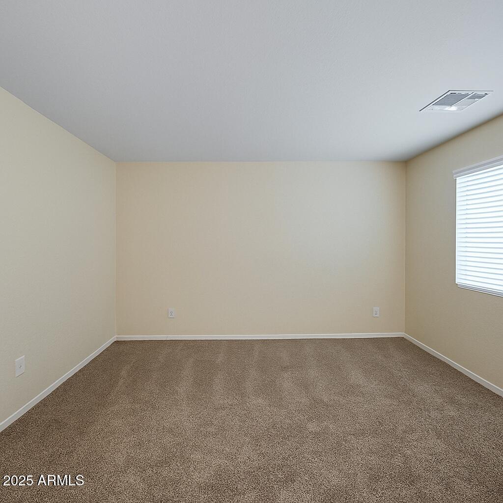 23993 West Pecan Road Buckeye, AZ 85326 - Photo 9 of 12 an empty room with a window