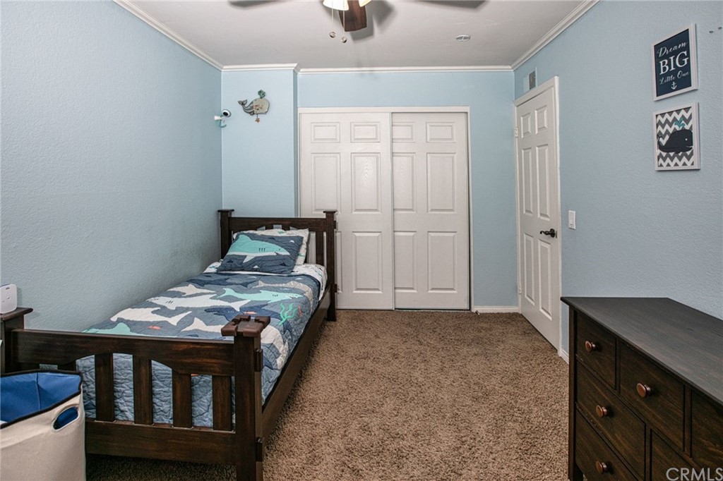 7314 East Equitation Way Orange, CA 92869 - Photo 25 of 37 a bedroom with a bed and a dresser