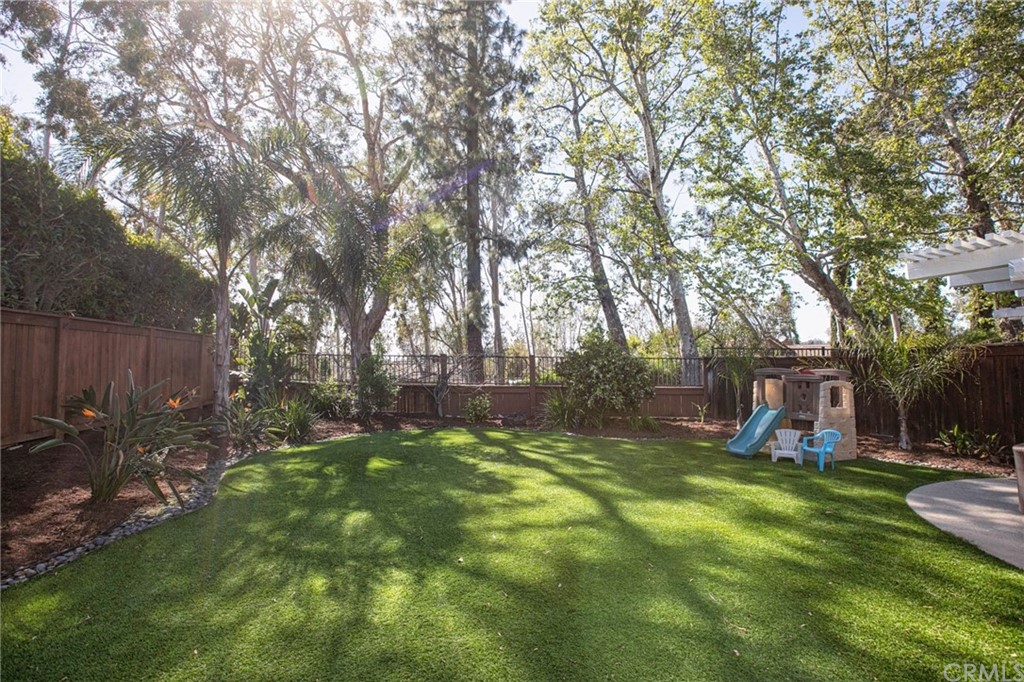 7314 East Equitation Way Orange, CA 92869 - Photo 30 of 37 a view of a backyard with a large tree