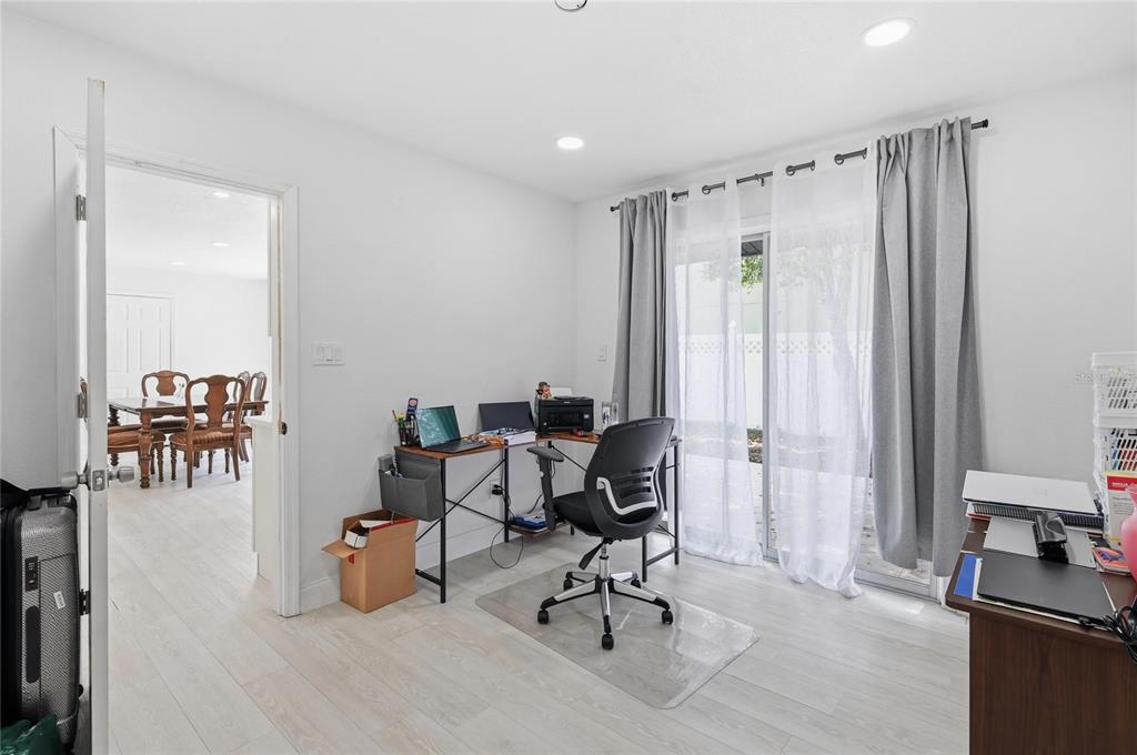 1946 Strathaven Road Winter Park, FL 32792 - Photo 25 of 37 a workspace with furniture and a chandelier