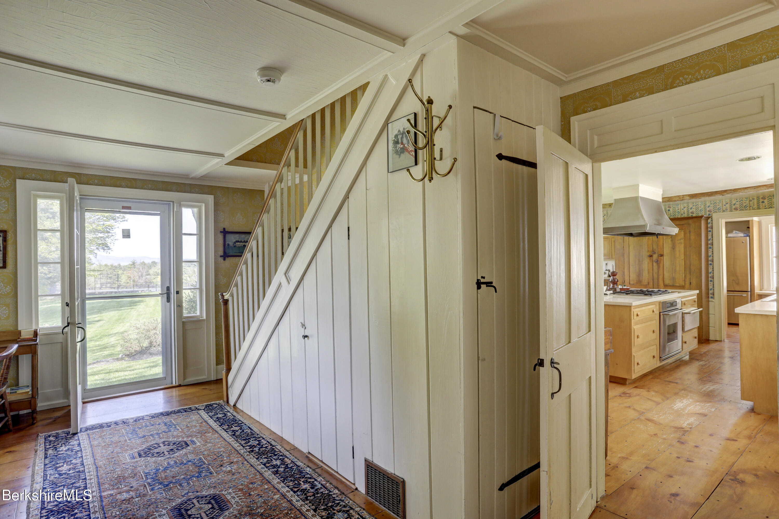 185 Keyes Hill Road New Marlborough, MA 01259 - Photo 21 of 49 a view of an entryway with wooden floor and a livingroom