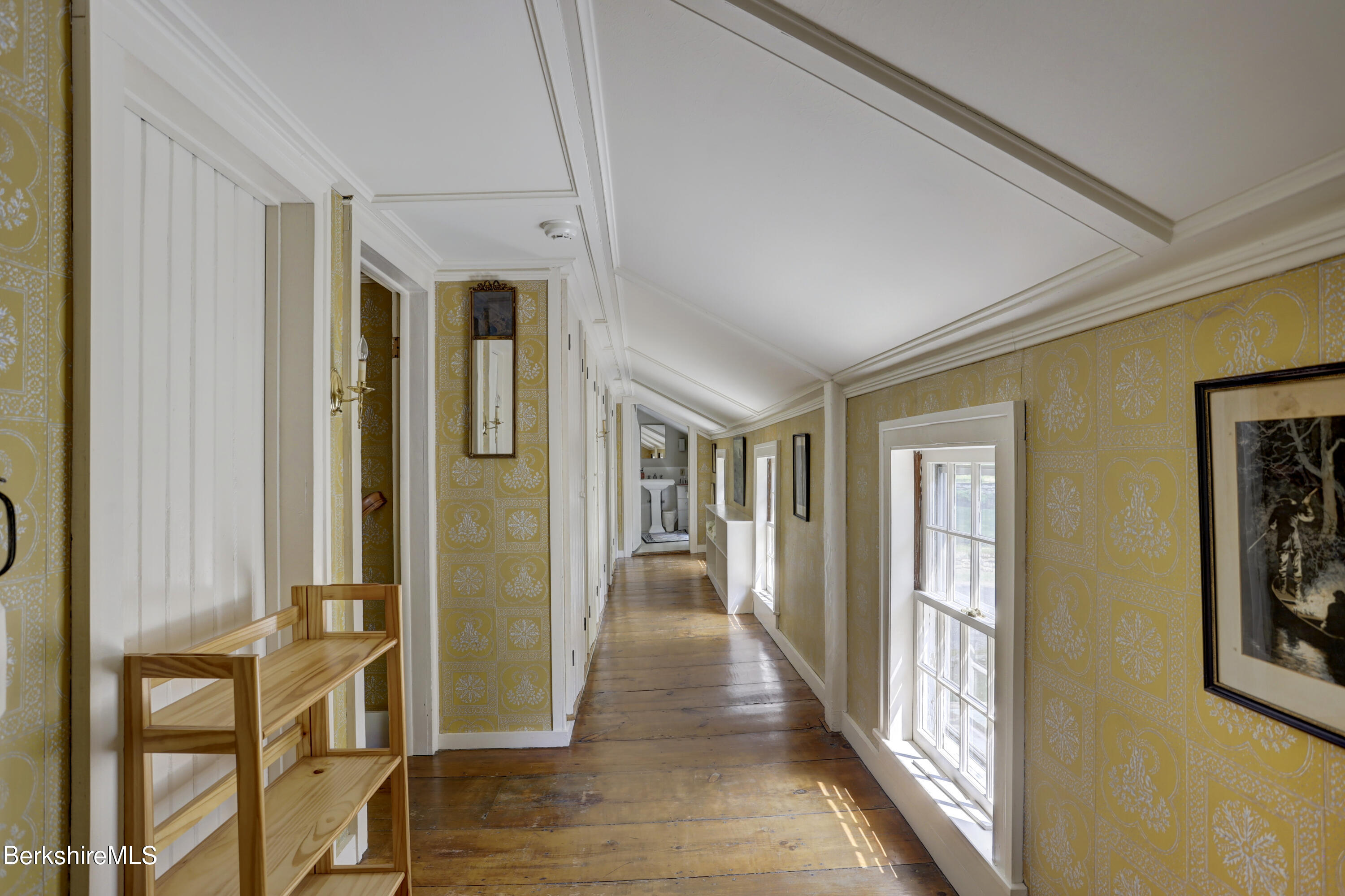 185 Keyes Hill Road New Marlborough, MA 01259 - Photo 23 of 49 a view of a hallway with wooden floor and windows