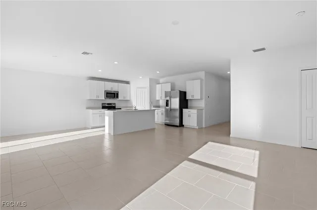 a view of kitchen with wooden floor