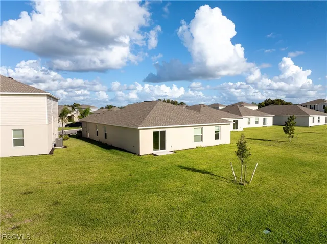 a view of a house with a big yard