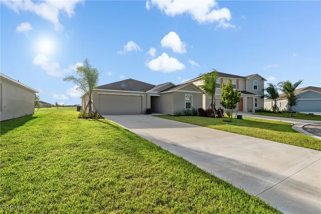 a view of a house with a big yard